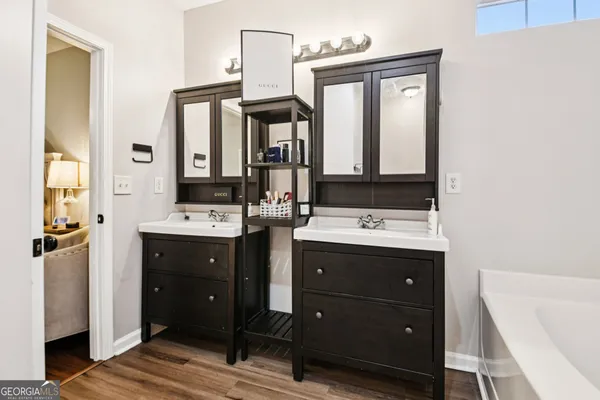 a bathroom with a sink vanity and mirror