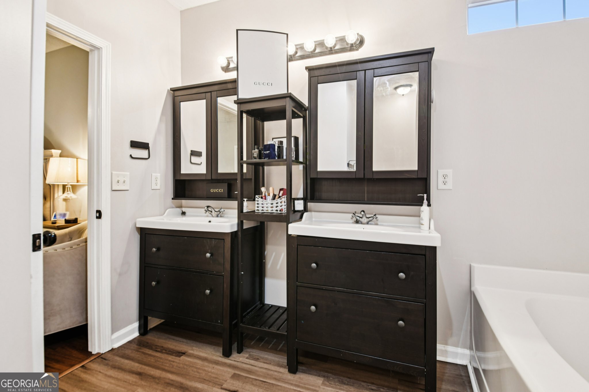 564 Goldfinch Way Stockbridge, GA 30281 - Photo 22 of 31 a bathroom with a sink vanity and mirror