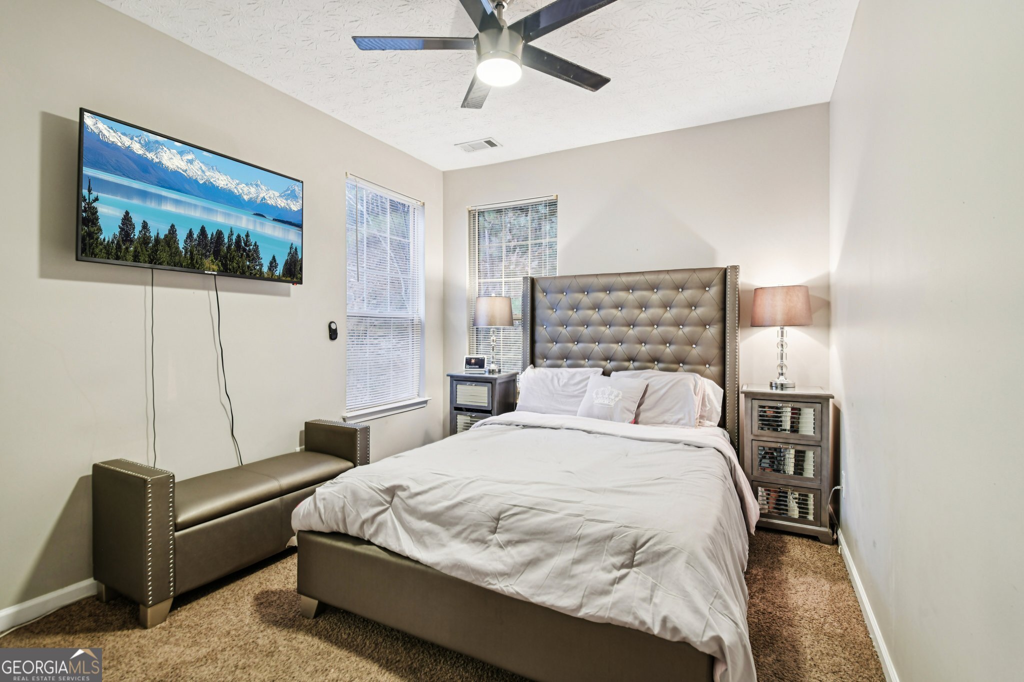 564 Goldfinch Way Stockbridge, GA 30281 - Photo 25 of 31 a bedroom with a bed and a wall painting