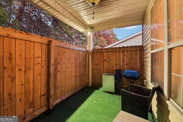 a view of a backyard with furniture