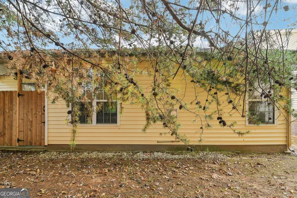 a view of a backyard of the house