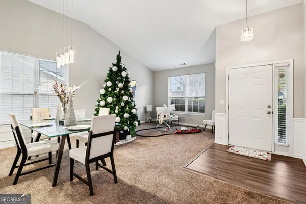 a livingroom with furniture and wooden floor