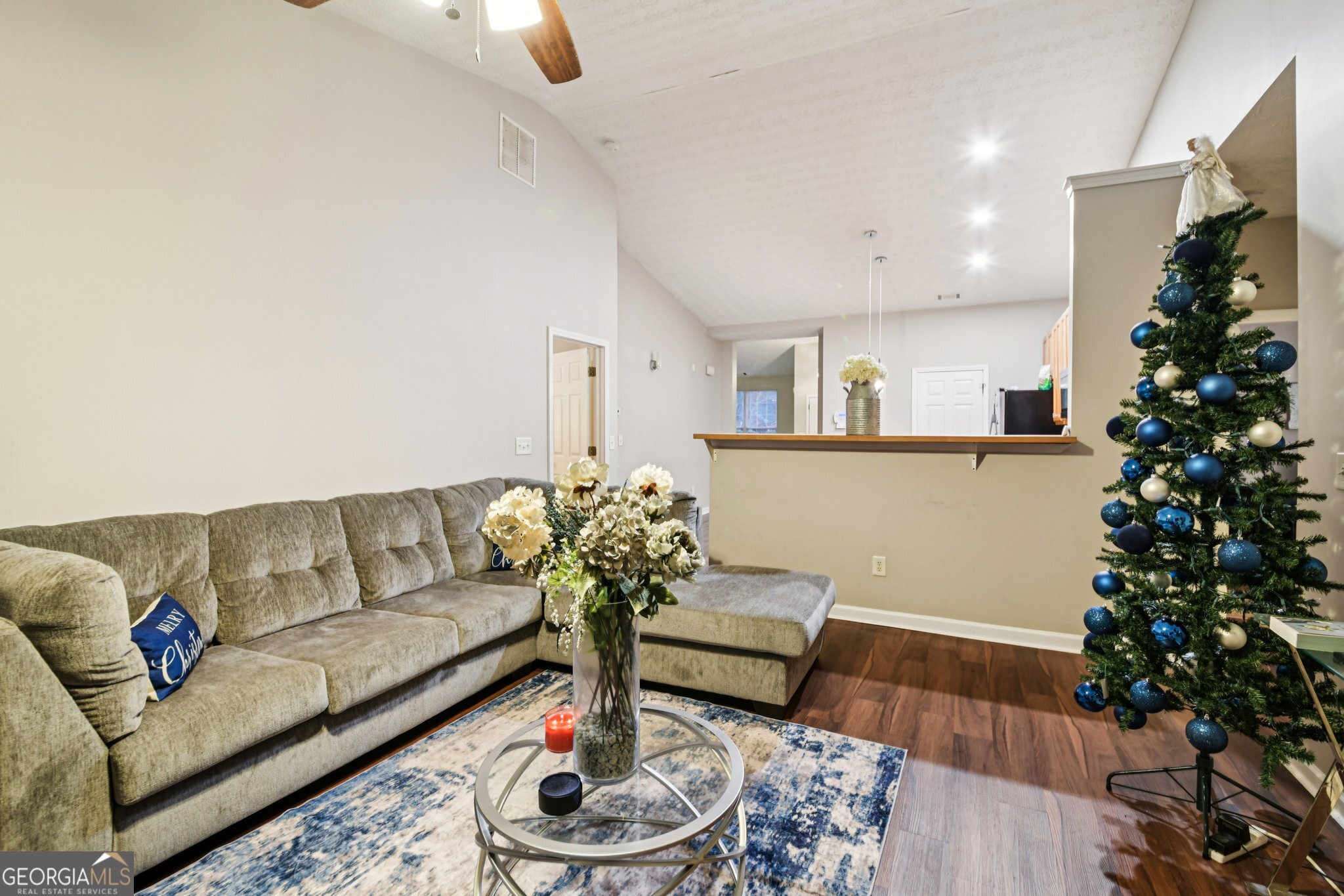 564 Goldfinch Way Stockbridge, GA 30281 - Photo 7 of 31 a living room with furniture and a potted plant