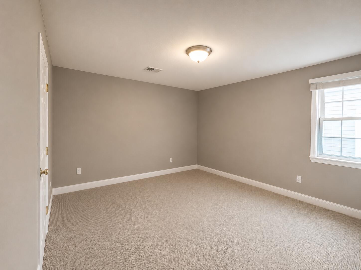 63 Security Street, Unit 1 Hyannis, MA 02601 - Photo 5 of 8 an empty room with a window