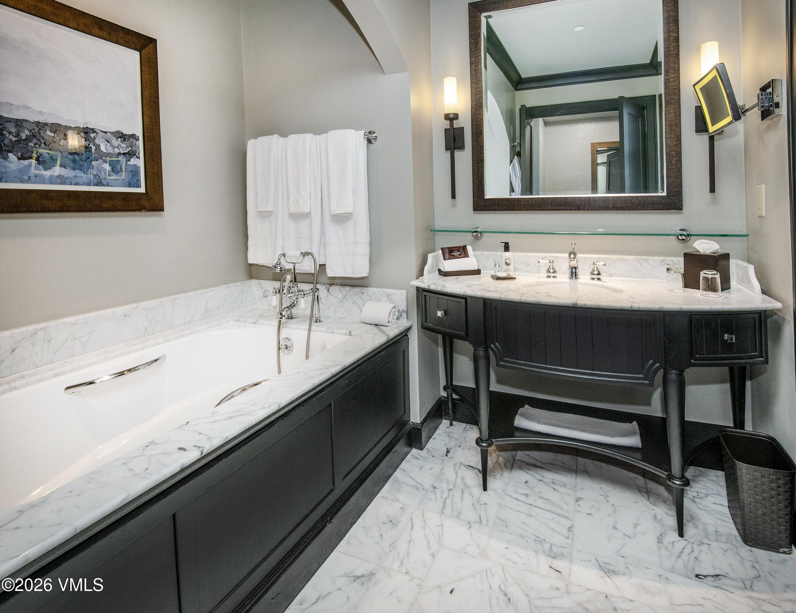 130 Daybreak Ridge Road, Unit HS716 Avon, CO 81620 - Photo 15 of 25 a bathroom with a sink and a mirror