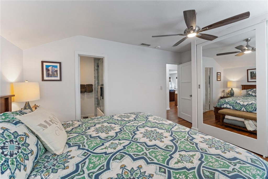 280 Tivoli Drive Long Beach, CA 90803 - Photo 14 of 22 a bedroom with a bed and a chandelier