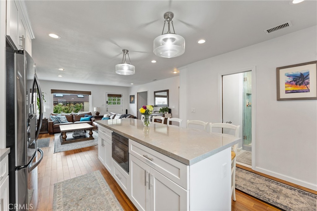 280 Tivoli Drive Long Beach, CA 90803 - Photo 9 of 22 a kitchen with stainless steel appliances granite countertop a lot of counter top and refrigerator