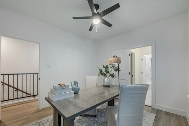 a view of a room with a table and chairs