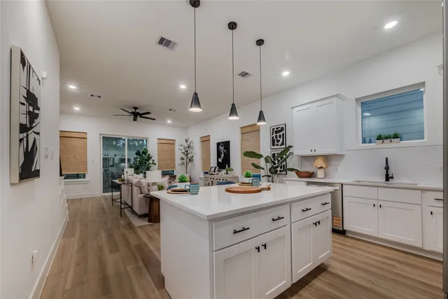 a open kitchen with sink cabinets and stove