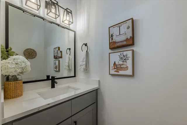 a bathroom with a sink and a mirror