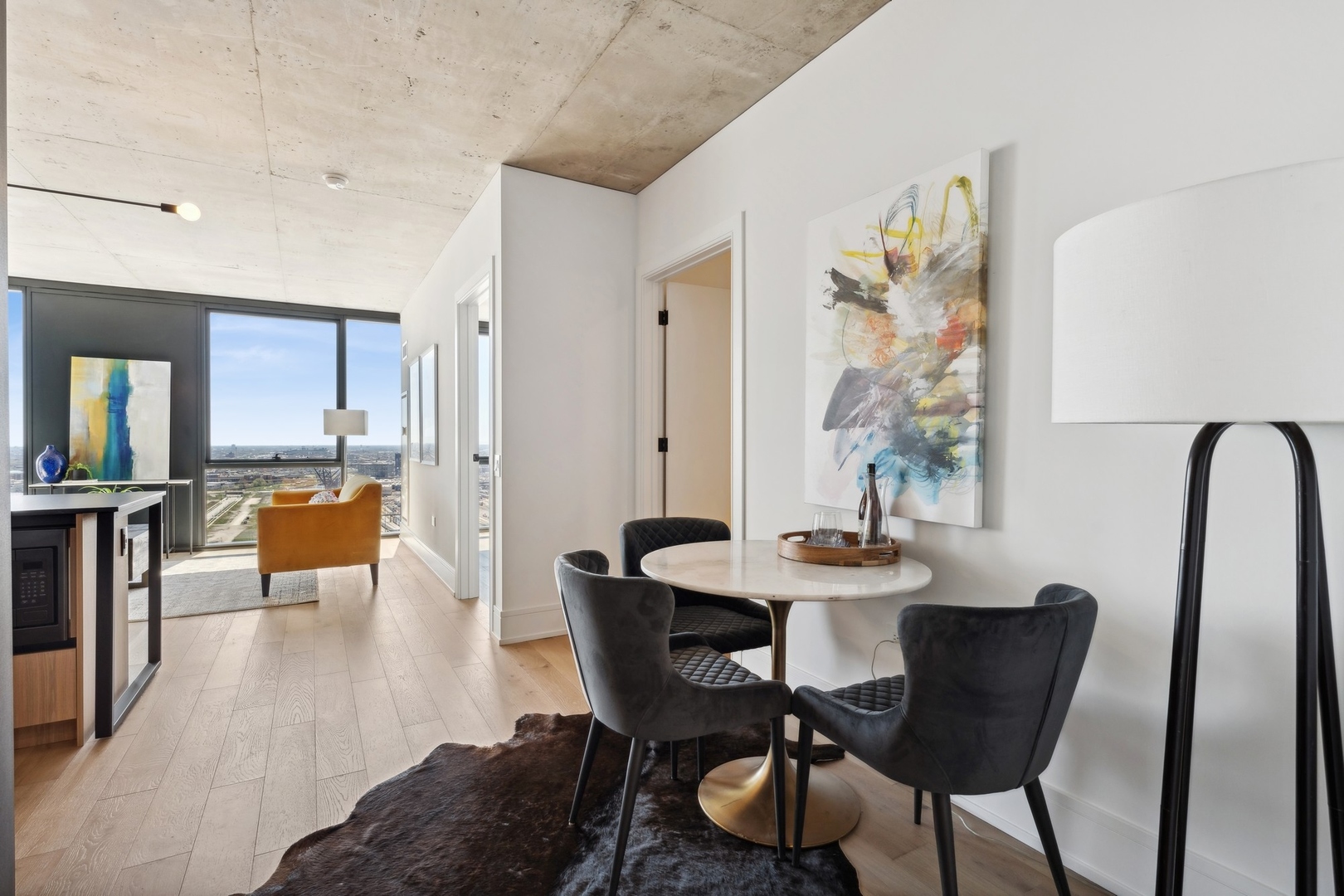 234 West Polk Street, Unit 3503 Chicago, IL 60607 - Photo 13 of 36 a dining room with furniture and wooden floor