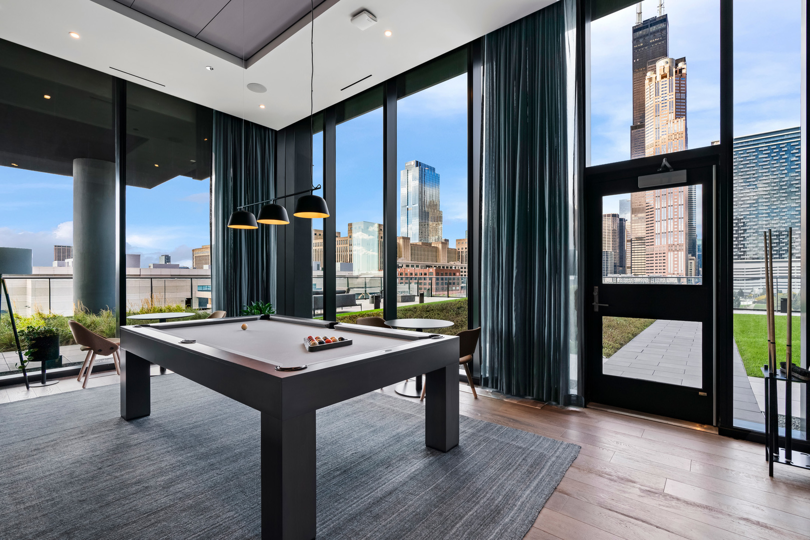 234 West Polk Street, Unit 3503 Chicago, IL 60607 - Photo 28 of 36 a room with pool table and windows