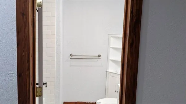 a bathroom with a glass door