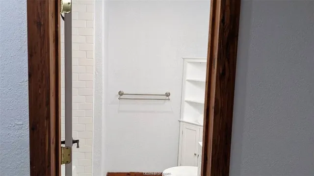 a bathroom with a glass door