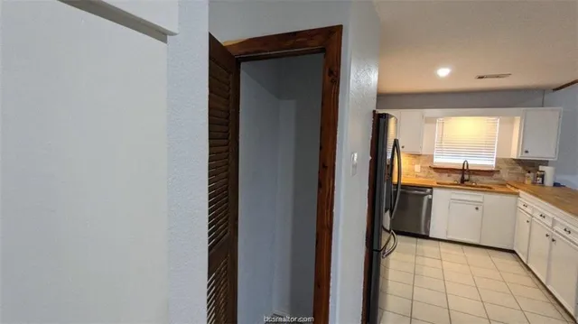 a bathroom with a sink a mirror and a bathtub