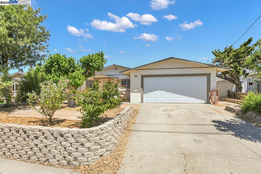 28 Oceanview Drive Bay Point, CA 94565 - Photo 1 of 1 a front view of a house with a yard and garage