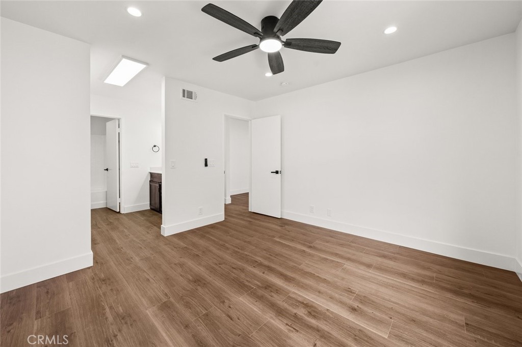 2554 Olive Drive, Unit 84 Palmdale, CA 93550 - Photo 13 of 21 a view of an empty room with wooden floor