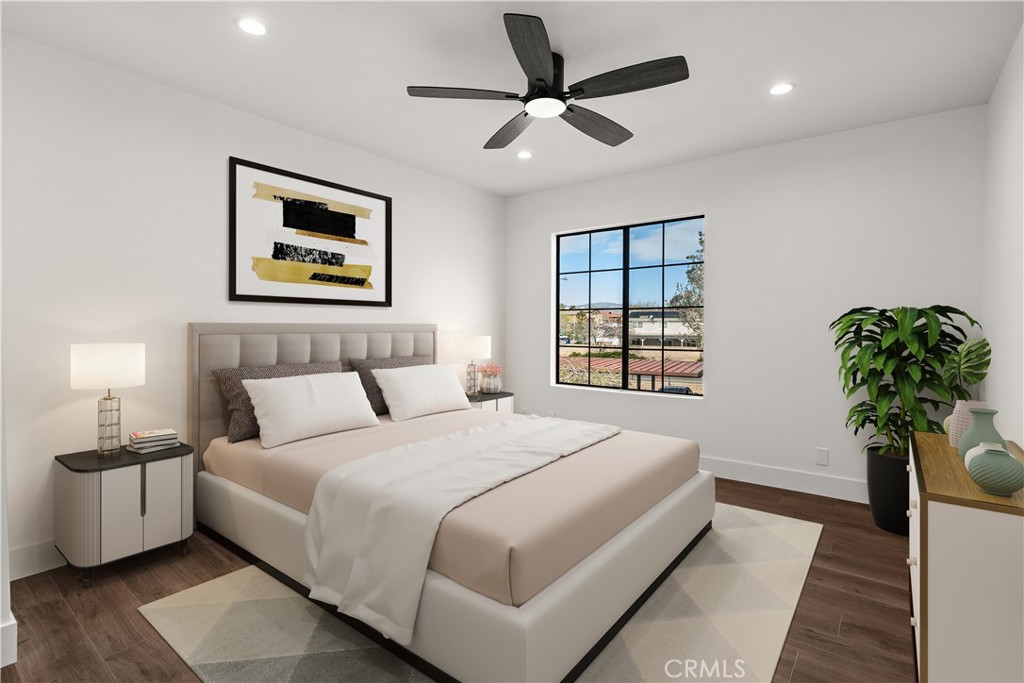 2554 Olive Drive, Unit 84 Palmdale, CA 93550 - Photo 16 of 21 a bedroom with a bed and a potted plant