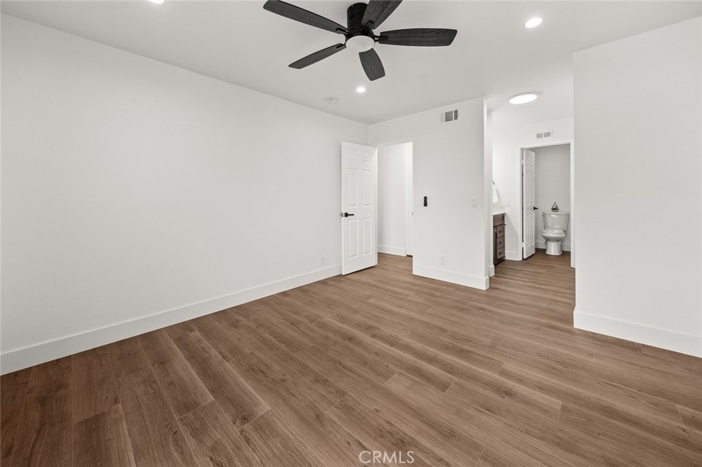 2554 Olive Drive, Unit 84 Palmdale, CA 93550 - Photo 17 of 21 a view of an empty room and wooden floor