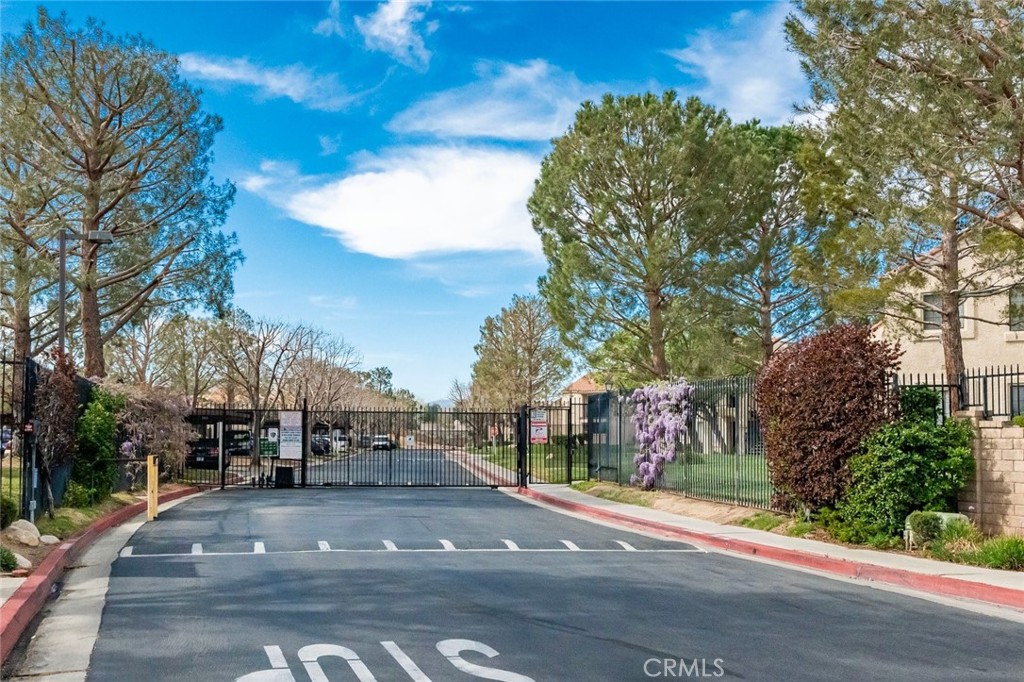2554 Olive Drive, Unit 84 Palmdale, CA 93550 - Photo 21 of 21 a view of street with trees