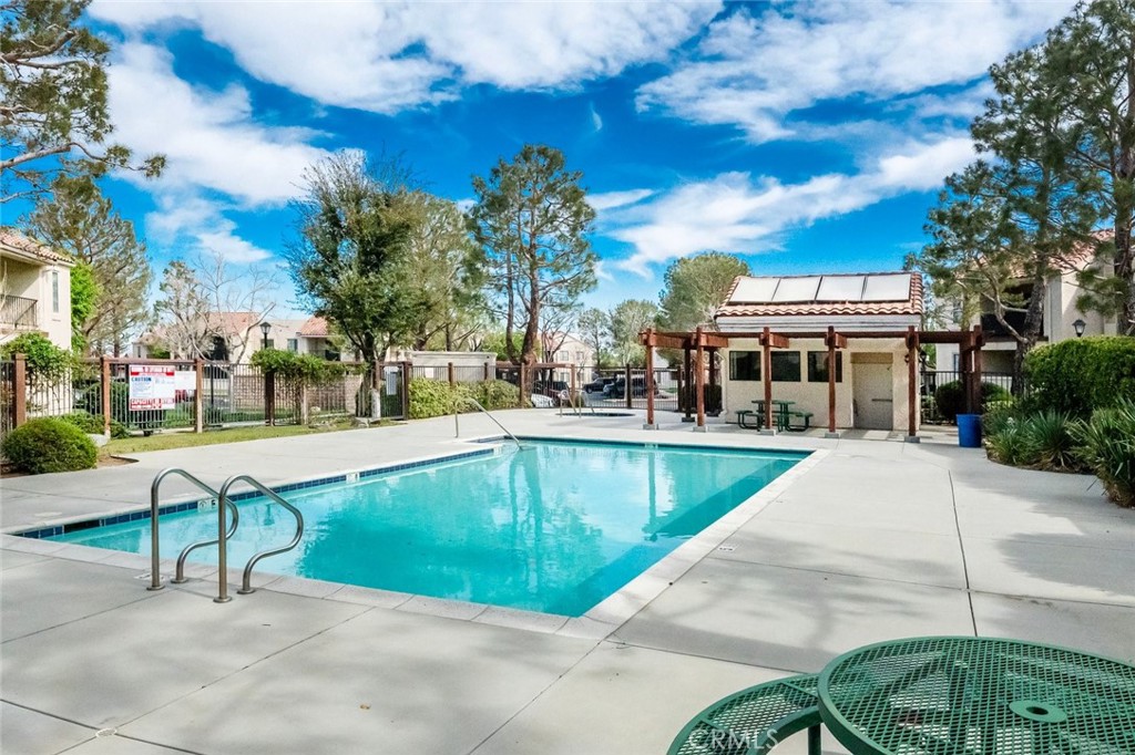2554 Olive Drive, Unit 84 Palmdale, CA 93550 - Photo 3 of 21 a view of a swimming pool with a patio