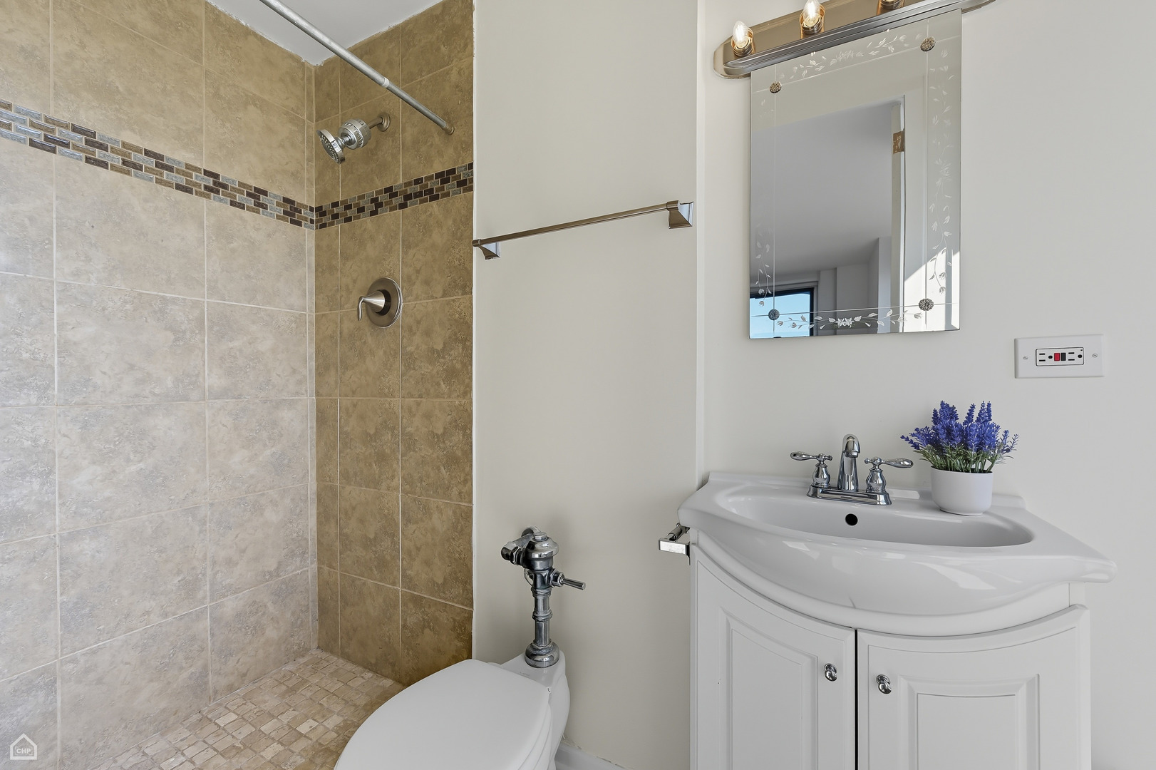 1400 East 55th Place, Unit 702S Chicago, IL 60637 - Photo 8 of 11 a bathroom with a sink toilet and shower