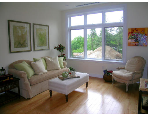 120 Seaver Street, Unit C102 Brookline, MA 02445 - Photo 4 of 7 a living room with furniture and a large window
