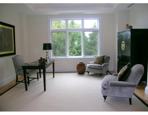 120 Seaver Street, Unit C102 Brookline, MA 02445 - Photo 5 of 7 a living room with furniture and a flat screen tv