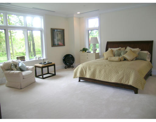 120 Seaver Street, Unit C102 Brookline, MA 02445 - Photo 6 of 7 a spacious bedroom with a bed and glass window