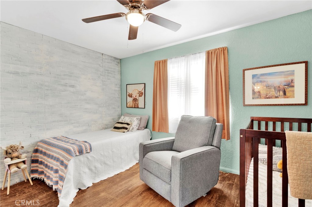 12655 Pocono Road Apple Valley, CA 92308 - Photo 25 of 52 a bedroom with furniture and a large window