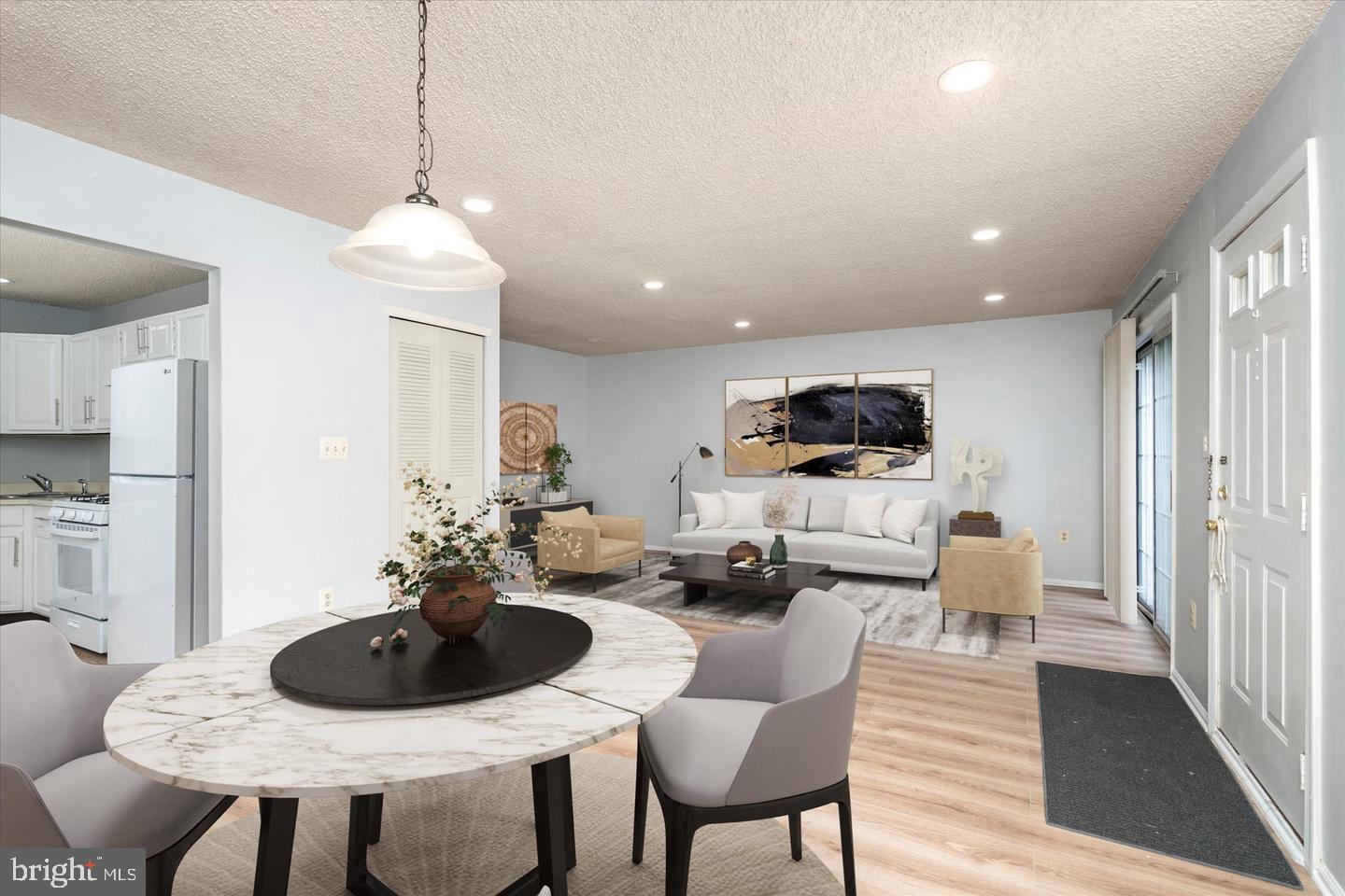 110 Versailles Court Hamilton, NJ 08619 - Photo 4 of 19 a living room with furniture kitchen view and a wooden floor
