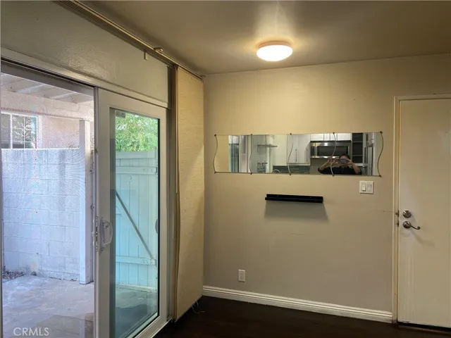 a bathroom with a sink mirror and toilet