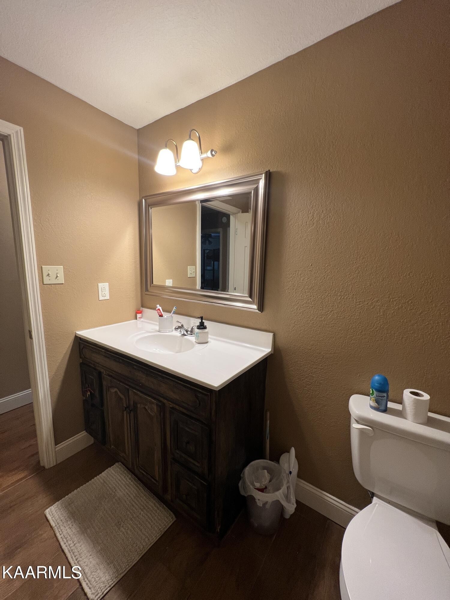 502 Claiborne Road La Follette, TN 37766 - Photo 16 of 28 a bathroom with a sink mirror and toilet