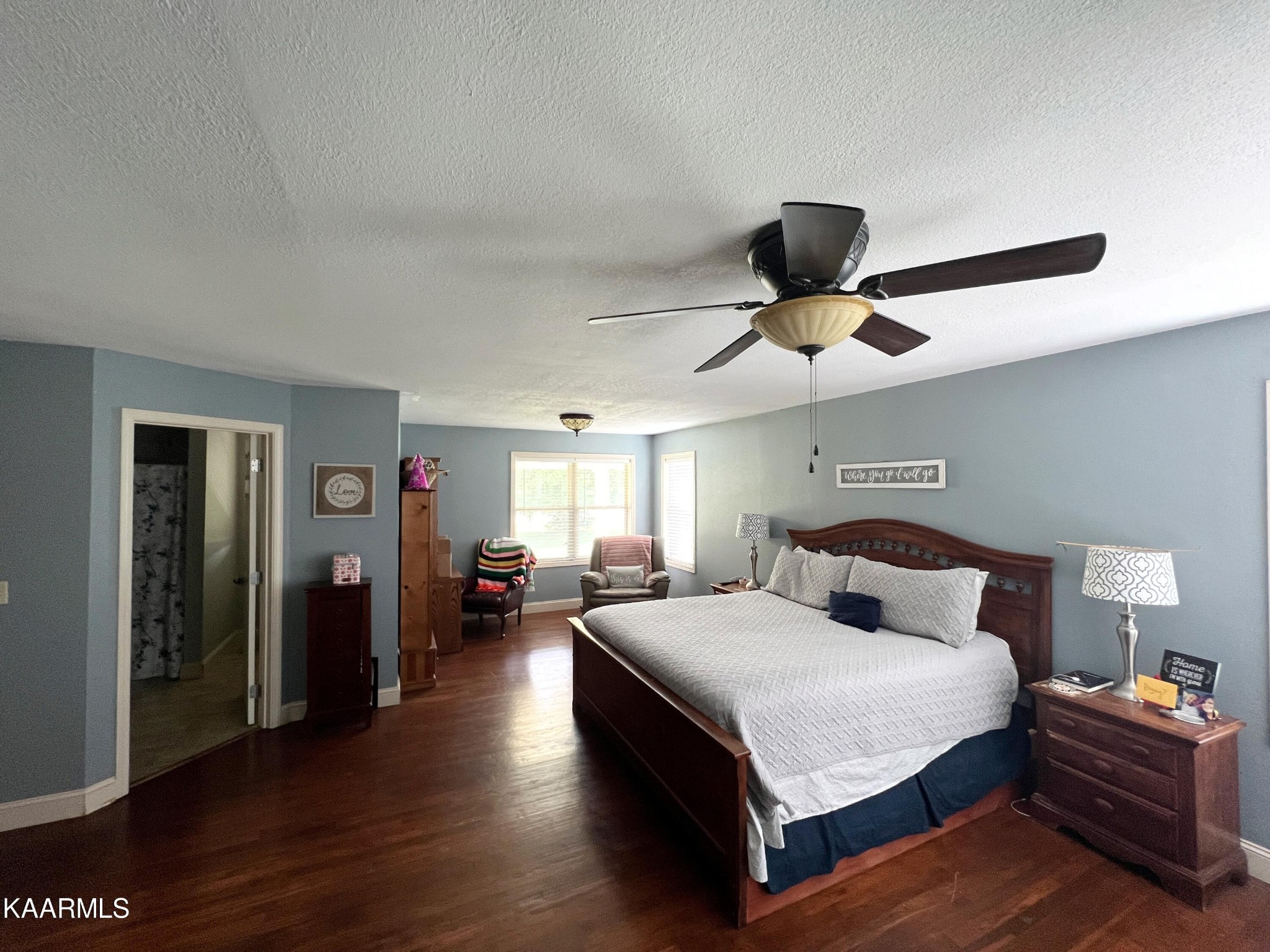 502 Claiborne Road La Follette, TN 37766 - Photo 26 of 28 a bedroom with a bed and wooden floor