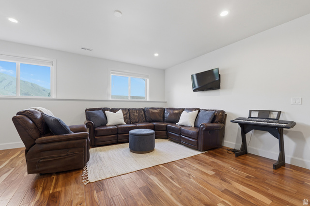 441 South 2080th Street East Springville, UT 84663 - Photo 29 of 64 Spacious room featuring wood-finish flooring, recessed lighting, and white walls