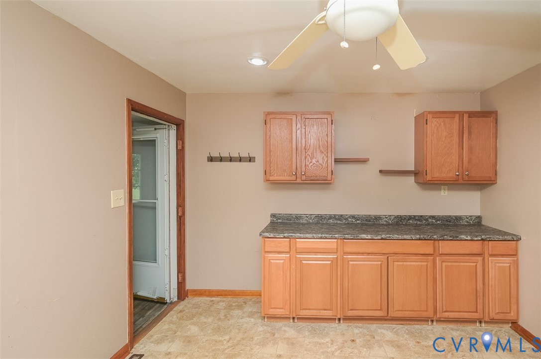 581 Smokey Road Aylett, VA 23009 - Photo 13 of 28 Utility room featuring ample cabinetry with wood-f