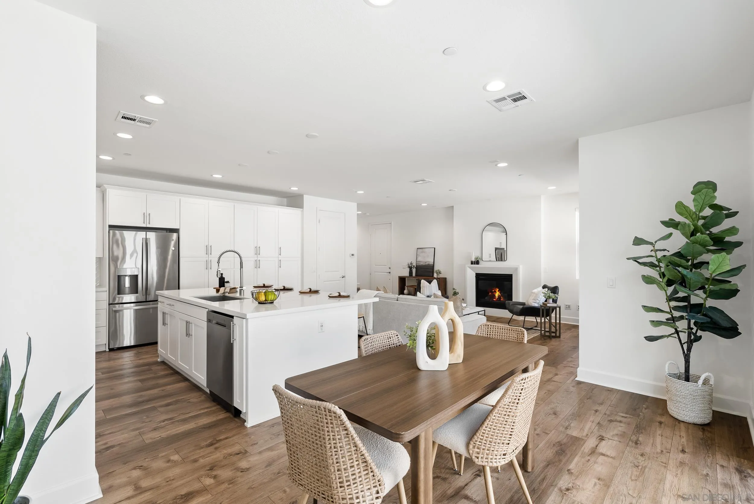 3304 Telaga Road Carlsbad, CA 92010 - Photo 13 of 60 a kitchen with a table and chairs in it