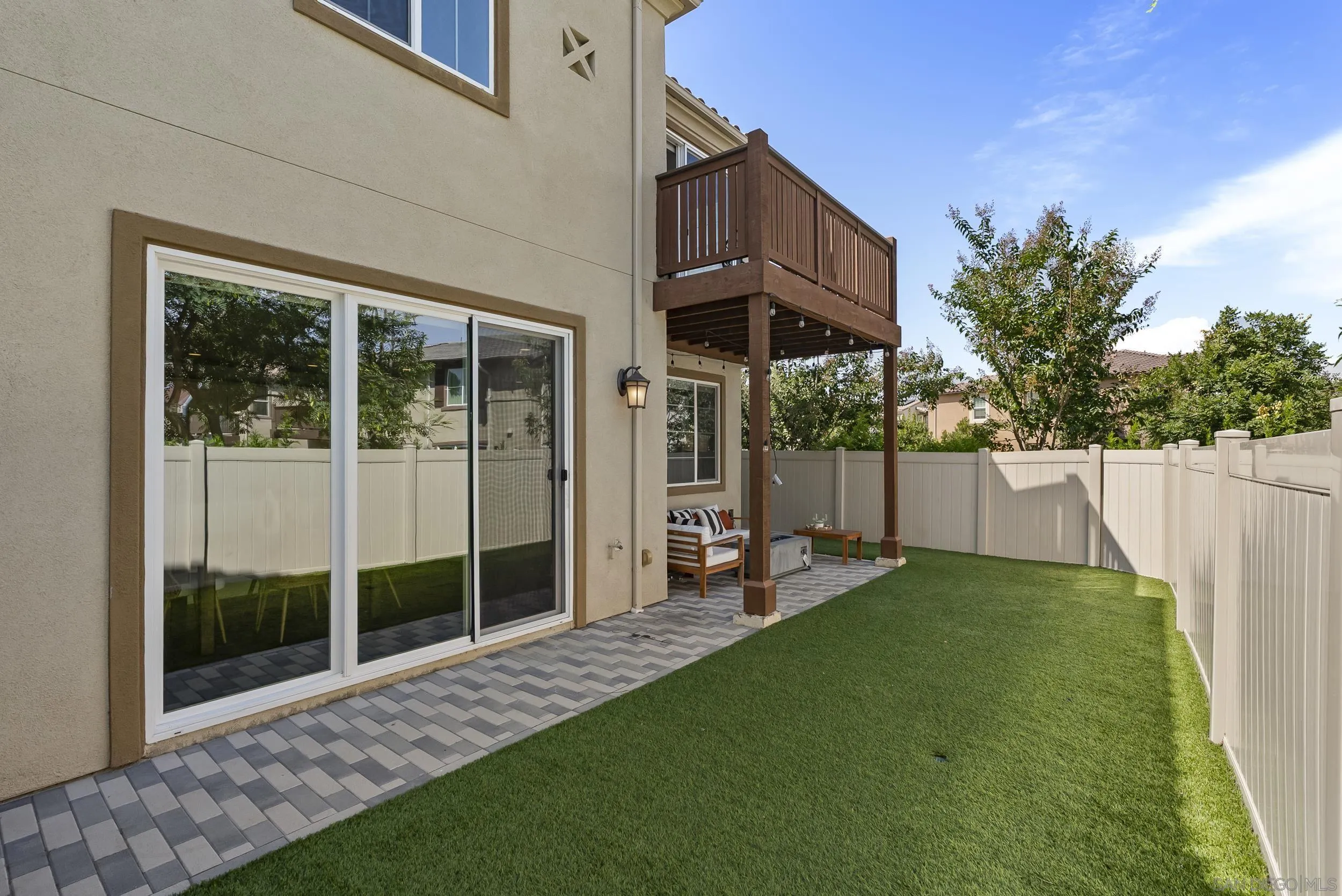 3304 Telaga Road Carlsbad, CA 92010 - Photo 36 of 60 a view of a chair and table in backyard of the house