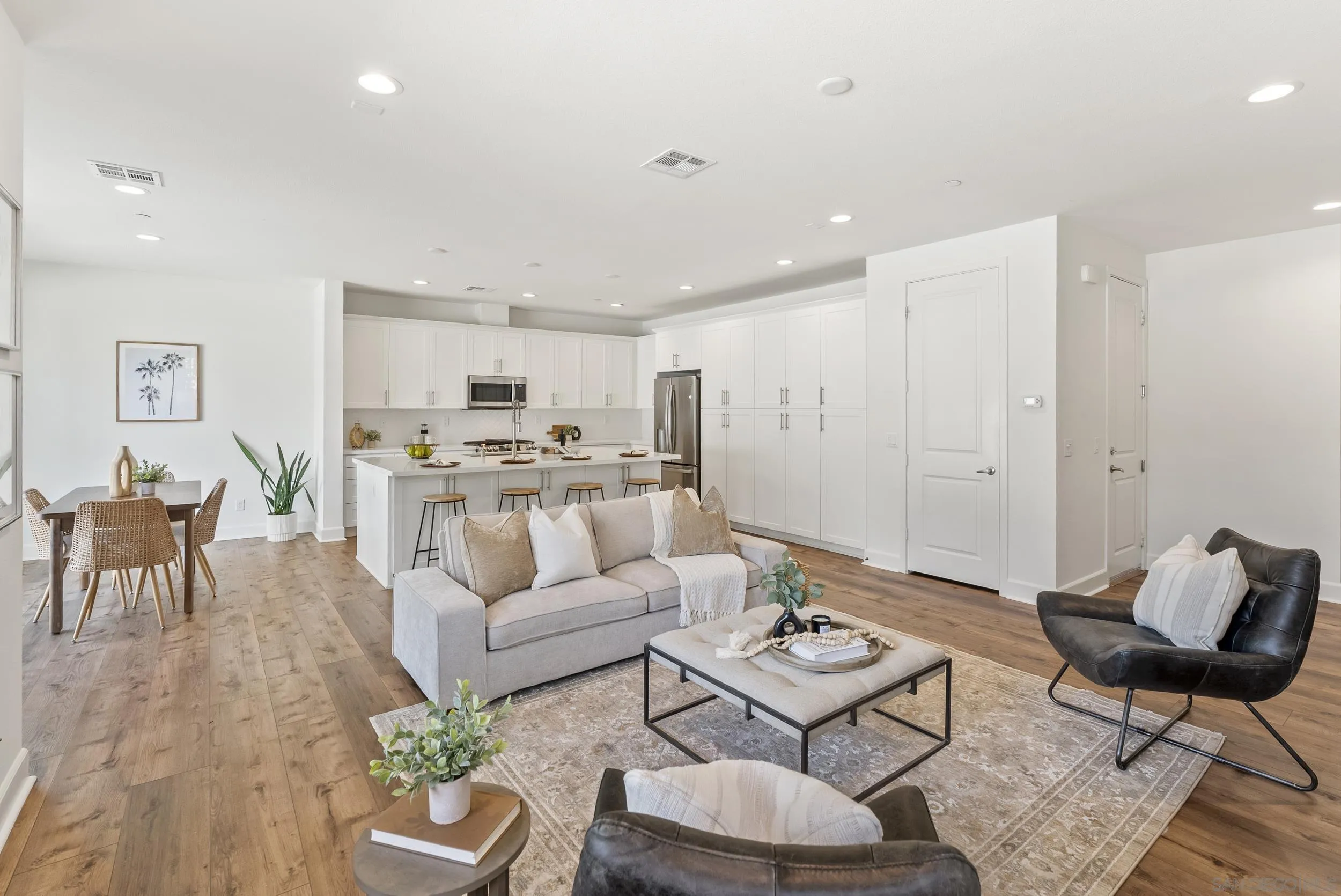 3304 Telaga Road Carlsbad, CA 92010 - Photo 10 of 60 a living room with furniture kitchen view and a table
