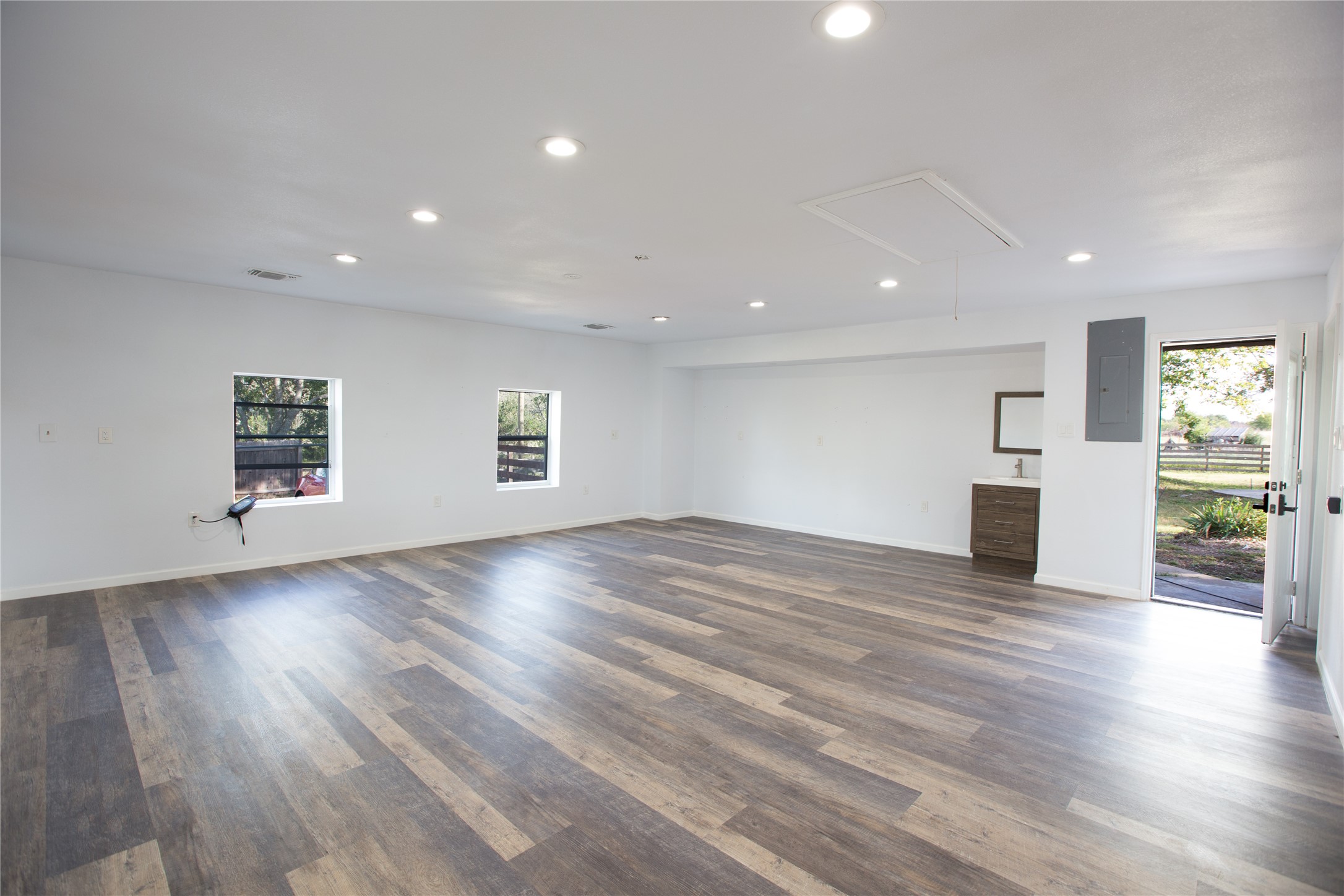 3517 Gattis School Road Round Rock, TX 78664 - Photo 4 of 16 A spacious, naturally illuminated room features durable flooring and convenient outdoor access.