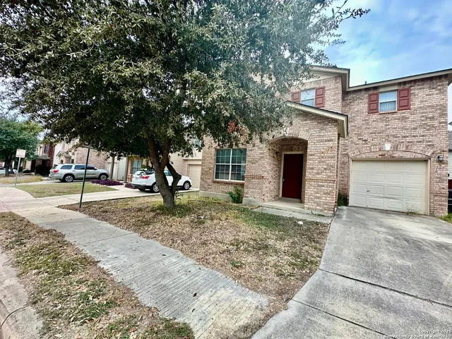 a view of a trees in front of a house