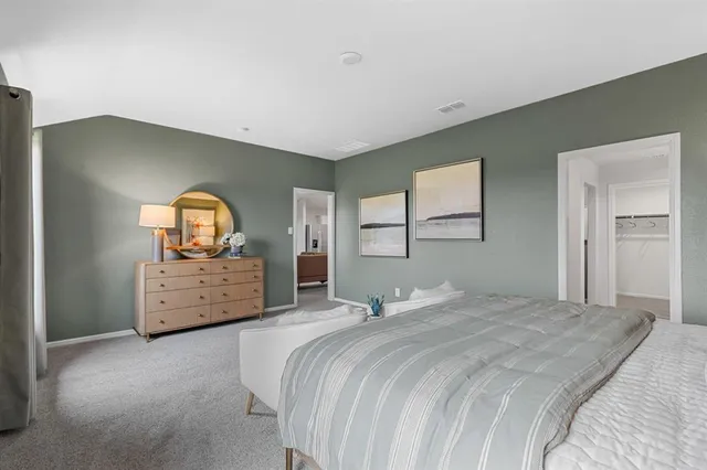 a bed room with a bed and a window