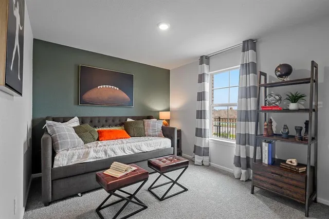 a room with furniture and gym equipment