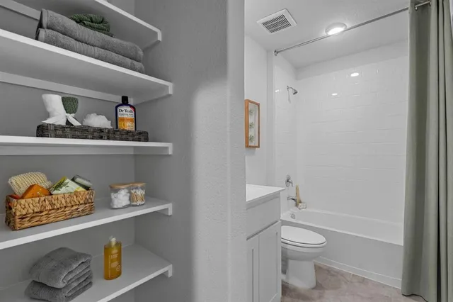 a bathroom with a toilet and a sink