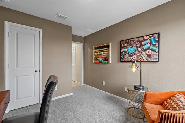 a workspace with furniture and wall painting