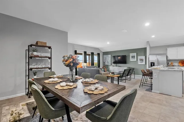 a kitchen with stainless steel appliances granite countertop a sink and a stove