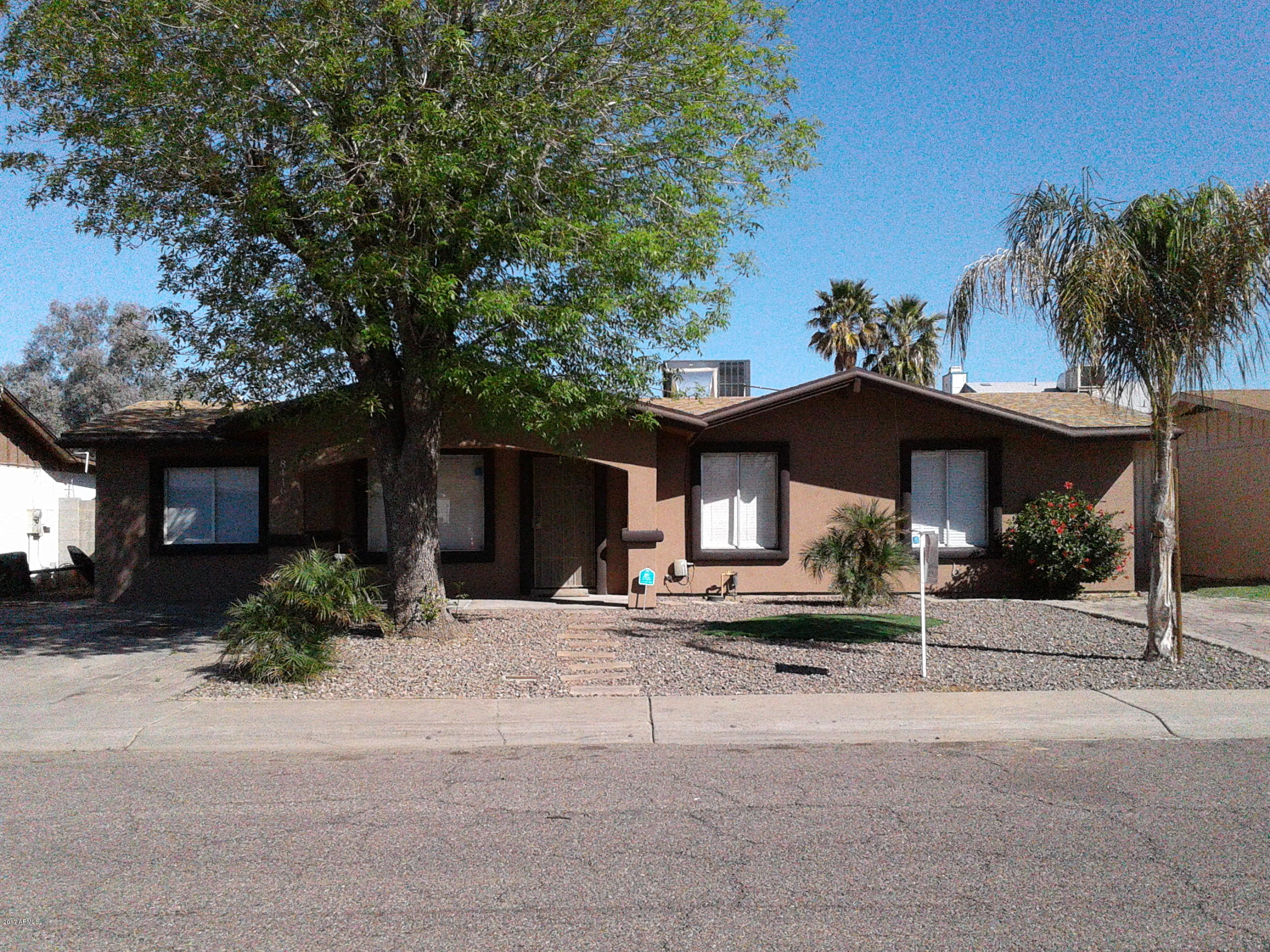 8416 West Roma Avenue Phoenix, AZ 85037 - Photo 1 of 33 a house view with a outdoor space