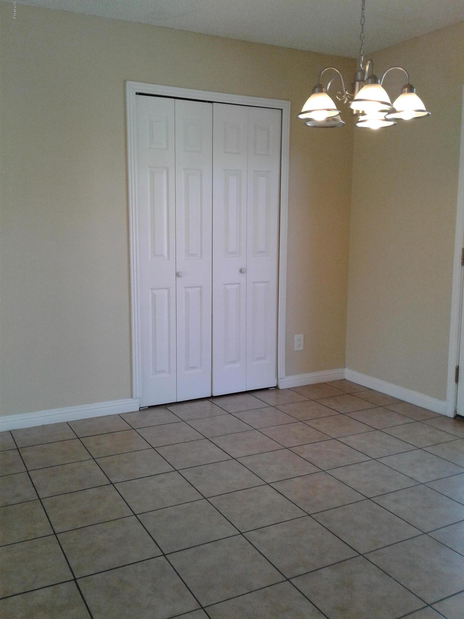 8416 West Roma Avenue Phoenix, AZ 85037 - Photo 12 of 33 an empty room with kitchen view