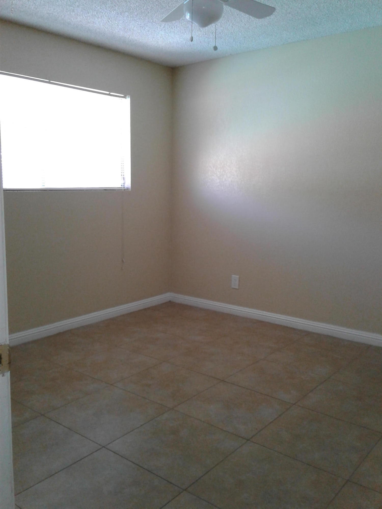 8416 West Roma Avenue Phoenix, AZ 85037 - Photo 16 of 33 a room that has a window in it