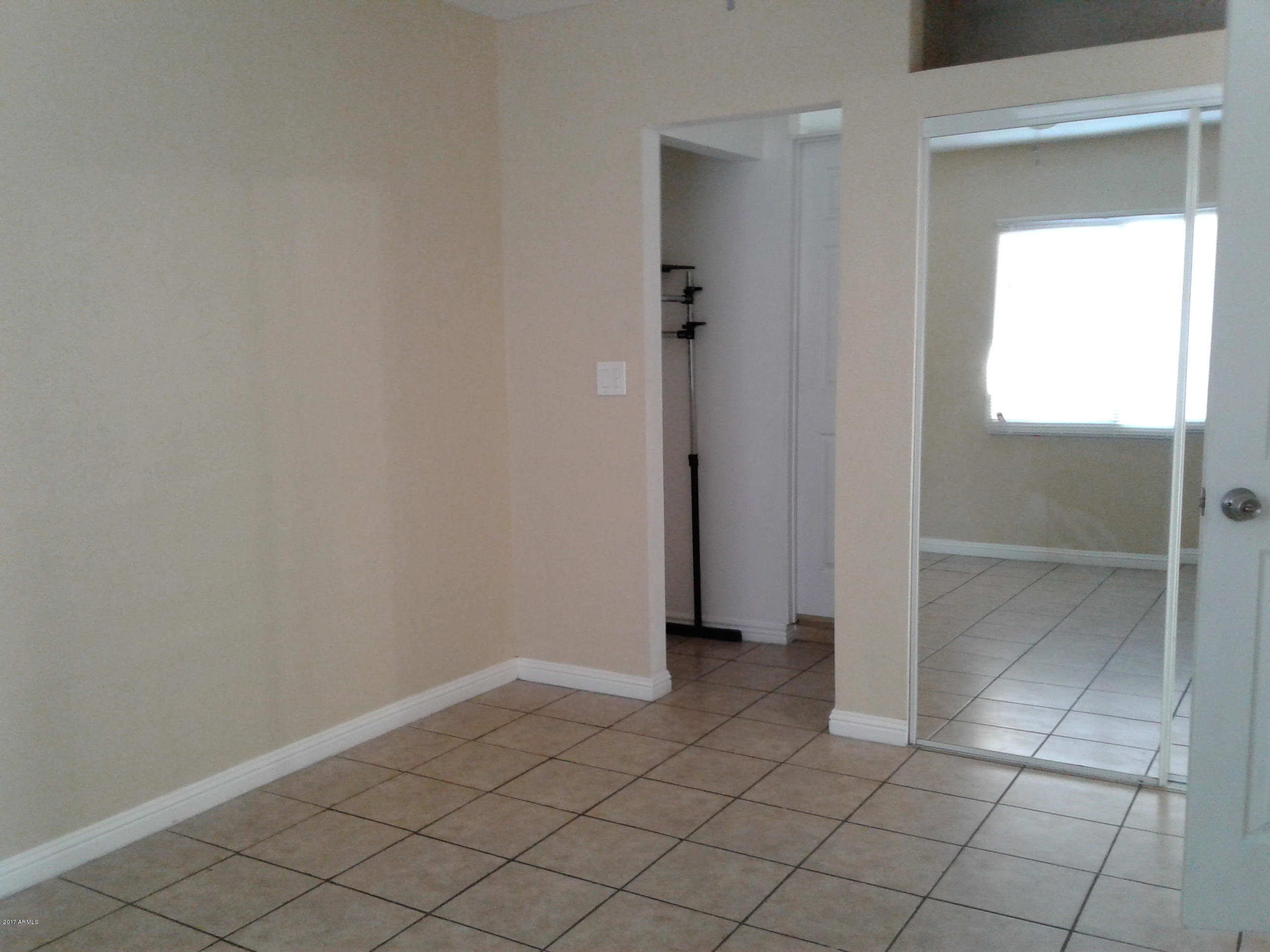 8416 West Roma Avenue Phoenix, AZ 85037 - Photo 20 of 33 a view of an empty room and closet